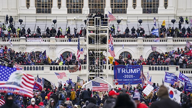 Insurrectionists loyal to President Donald Trump breach the U.S. Capitol in Washington, on Jan. 6, 2021. Four people associated with the Oath Keepers were convicted on Monday, March 20, 2023, of conspiracy and obstruction charges stemming from the attack on the U.S. Capitol in the latest trial involving members of the far-right antigovernment extremist group.