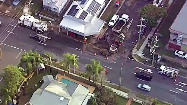 Residents of a suburban Brisbane street have told of how they awoke to their homes and backyards being flooded after a burst water main caused a sinkhole this morning
