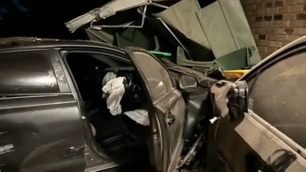 Locals have made a citizens arrest after a driver allegedly ploughed through a fence into a home in Brisbane. 