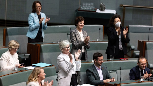Crossbenchers applaud after the National Anti-Corruption Commission Bill passed the House of Representatives
