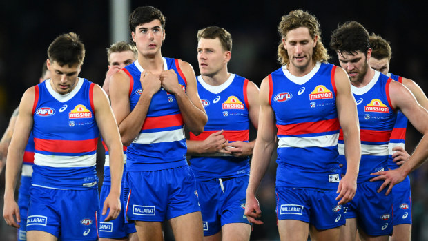 The Bulldogs look dejected after losing the round 13 AFL match between Western Bulldogs and Port Adelaide Power at Marvel Stadium, on June 09, 2023, in Melbourne, Australia. (Photo by Quinn Rooney/Getty Images)