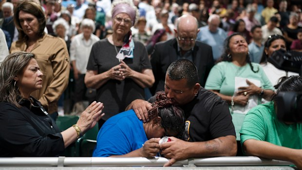 Family members of one of the victims killed in Tuesday's shooting at Robb Elementary School embrace each other after a prayer vigil in Uvalde, Texas.