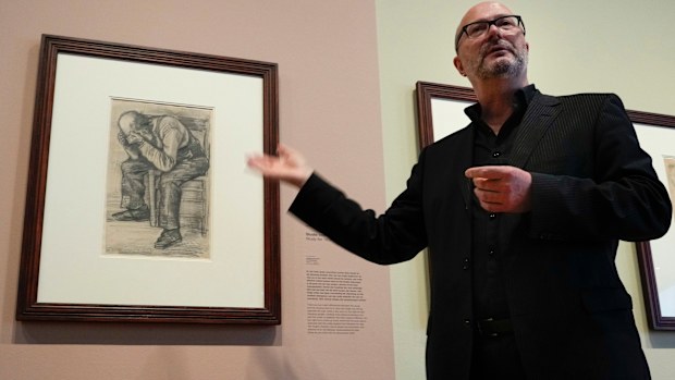 Senior researcher Teio Meedendorp gestures during the presentation of Study for "Worn Out", left, a drawing by Dutch master Vincent van Gogh, dated Nov. 1882, going on public display for the first time.