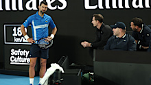 Novak Djokovic speaks with coach Andy Murray. 