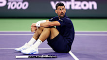INDIAN WELLS, CALIFORNIA - MARCH 11:  Novak Djokovic of Serbia sits up after falling to the court with exhaustion against Jack Draper of Great Britain in their fourth round match of the BNP Paribas Open at Indian Wells Tennis Garden on March 11, 2026 in Indian Wells, California. (Photo by Clive Brunskill/Getty Images)