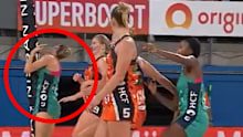 The Vixens' Kiera Austin makes contact with the goalpost.