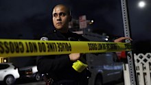 A law enforcement officer blocks off a street with police tape near an address connected to Cole Tomas Allen, the shooting suspect at the White House Correspondents Dinner on Saturday, April 25, 2026, in Torrance, Calif. (AP Photo/Ethan Swope)