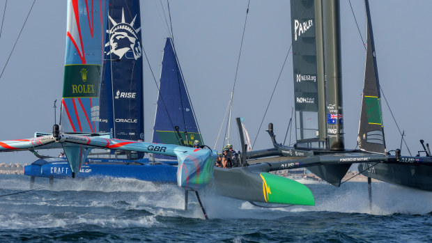 Great Britain, helmed by Ben Ainslie, USA helmed by Jimmy Spithill, and Australia, helmed by Tom Slingsby, competing in one of Sunday's fleet races.