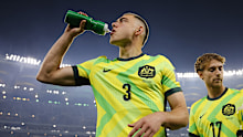Lewis Miller hydrates while playing for the Socceroos. 