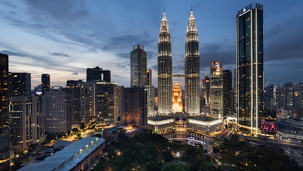 FILE The Petronas Twin Towers, center, stand at sunset in downtown Kuala Lumpur, Malaysia, Wednesday, Aug. 26, 2020. The Malaysian government said in a statement issued Friday, June 10, 2022, that it will abolish the mandatory death penalty and to substitute the punishment with other punishments upon the courts discretion. (AP Photo/Vincent Thian, File)