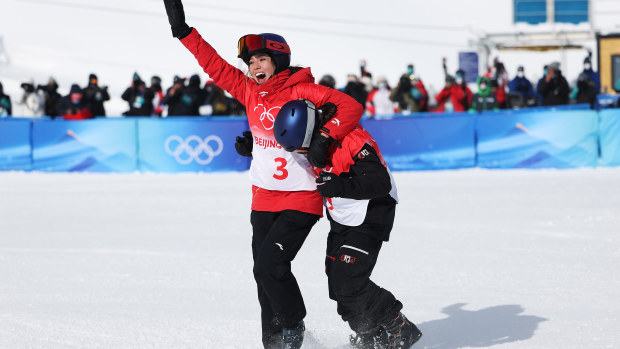 Mathilde Gremaud and Eileen Gu react after winning their medals during the women's freestyle skiing freeski slopestyle final.