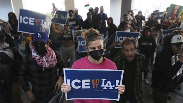 Protesters gather at the US Department of Justice Federal Bureau of Prisons after federal immigration authorities conducted an operation in Los Angeles.
