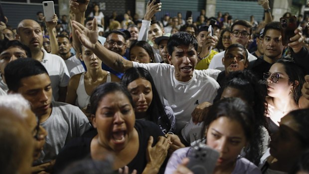 Supporters of opposition candidate Edmundo Gonzalez gather outside the Andres Bello School voting center, asking for the results, after the polls closed for the presidential elections in Caracas, Venezuela on Sunday, July 28.
