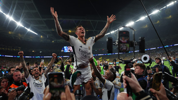 Toni Kroos of Real Madrid celebrates with teammates after winning.
