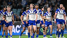 Canterbury Bulldogs react after the Sharks scored a try.