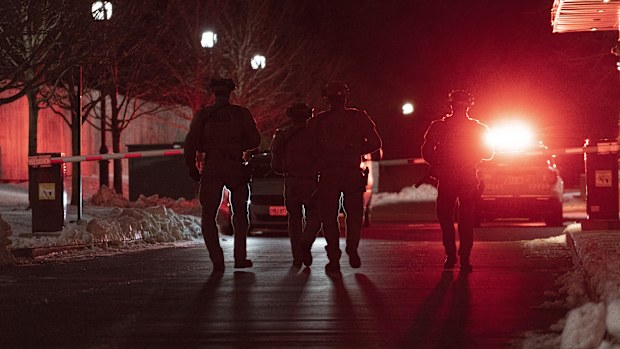 York Regional Police tactical officers work the scene of a fatal shooting in Vaughan, Ontario. Authorities said multiple people were shot and killed in a condominium unit in the Toronto suburb and the gunman was killed by police.  
