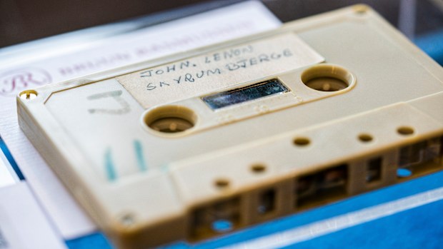 A view of a cassette with the recording of four Danish schoolboys' interviews with John Lennon and Yoko Ono during the famous couple's winter stay in Thy, in Jutland, Denmark, in 1970, on display at Bruun Rasmussen Auction House in Copenhagen Friday Sept. 24, 2021. Half a century ago, four Danish teenagers interviewed John Lennon for their school paper.
