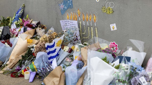 Flowers and a mural at the site of last Sunday's terrorist attack at Bondi Beach.