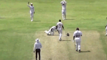 Louis kicks his helmet away.