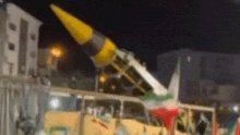 A Khorramshahr Missile, a medium range ballistic missile, is paraded through the streets of an Iranian city.