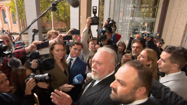 Kyle Sandilands was met with a media pack as he exited court this morning.