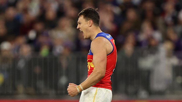 Hugh McCluggage of the Lions celebrates scoring a goal.