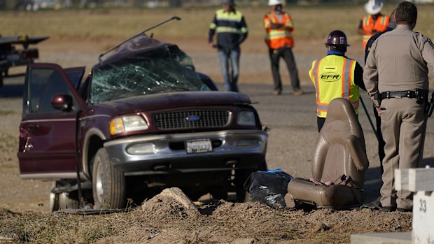 A law enforcement officer examines the scene of the deadly crash in Holtville, California.