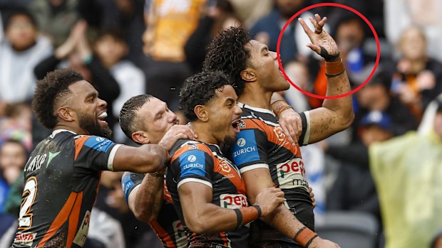 Wests Tigers player Samula Fainu gestures towards Bulldogs fans.