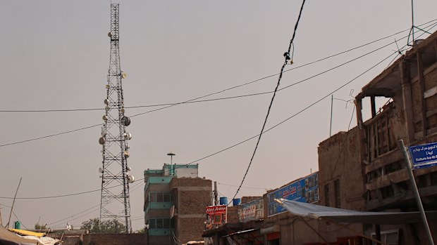 A communication tower stands in Jalalabad, Afghanistan, Wednesday, Oct. 1, 2025, after some networks were restored following an outage that began Monday. 