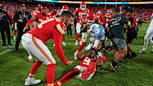 Detroit Lions defensive back Brian Branch fights with Kansas City Chiefs wide receiver JuJu Smith-Schuster.