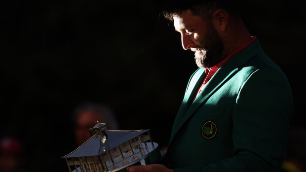 AUGUSTA, GEORGIA - APRIL 09: Jon Rahm of Spain celebrates with the Masters trophy during the Green Jacket Ceremony after winning the 2023 Masters Tournament at Augusta National Golf Club on April 9, 2023 in Augusta, Georgia. (Photo by Patrick Smith/Getty Images)