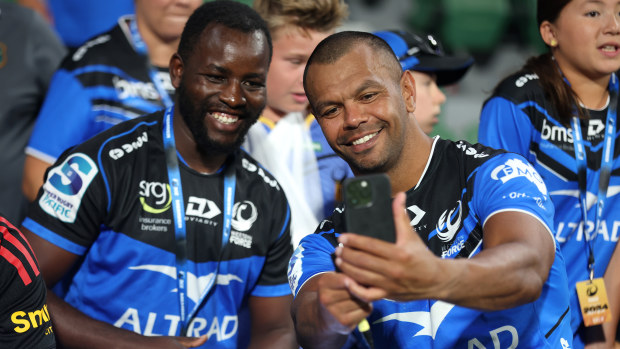 Kurtley Beale of the Force poses for a selfie with a fan after winning.