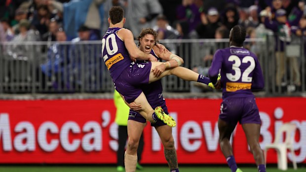 Patrick Voss of the Dockers celebrates a goal with Luke Jackson.