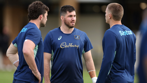 Liam Wright talks to teammates during a Wallabies training session at David Phillips Sports Complex.