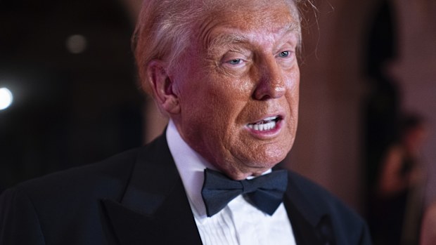 President-elect Donald Trump speaks to reporters before a New Year's Eve party at Mar-a-Lago, Tuesday, Dec. 31, 2024, in Palm Beach, Fla. (AP Photo/Evan Vucci)