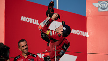 Jack Miller drinks Prosecco out of his shoe in celebration.
