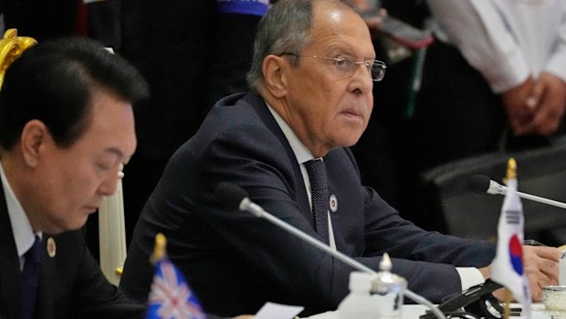 Sitting next to South Korea President Yoon Suk Yeol, left, Russian Foreign Minister Sergey Lavrov listens during the ASEAN Australia-New Zealand Trade Area (AANZTA) in Phnom Penh, Cambodia.