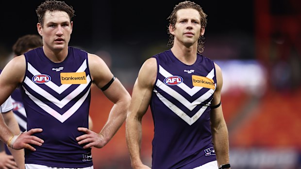 SYDNEY, AUSTRALIA - JUNE 17: Nat Fyfe of the Dockers and team mates look dejected after the round 14 AFL match between Greater Western Sydney Giants and Fremantle Dockers at GIANTS Stadium, on June 17, 2023, in Sydney, Australia. (Photo by Matt King/AFL Photos/via Getty Images )