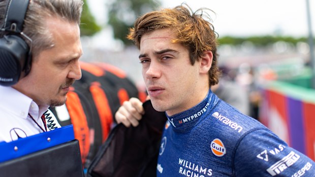 Franco Colapinto talks with his race engineer on the grid ahead of the Brazilian Grand Prix.