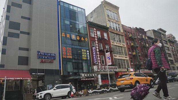 Justice Department officials say two men have been arrested on charges that they helped establish a secret police outpost in New York City on behalf of the Chinese government. 