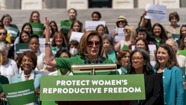 House Speaker Nancy Pelosi of Calif., accompanied by female House Democrats, speaks at an event ahead of a House vote on the Women's Health Protection Act and the Ensuring Women's Right to Reproductive Freedom Act at the Capitol in Washington, Friday, July 15, 2022. (AP Photo/Andrew Harnik)