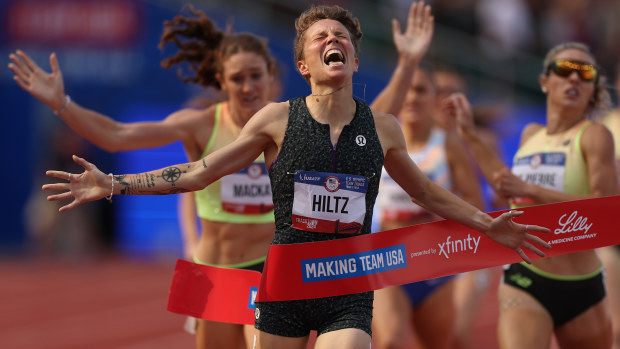 Nikki Hiltz celebrates crossing the finish line to win the women's 1500 metre final at the Olympic trials.