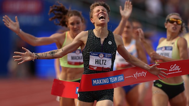 Nikki Hiltz celebrates crossing the finish line to win the women's 1500 metre final at the Olympic trials.