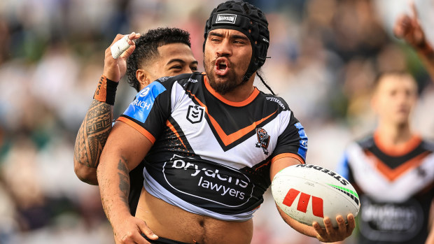 Isaiah Papali'i of the Tigers celebrates a try.