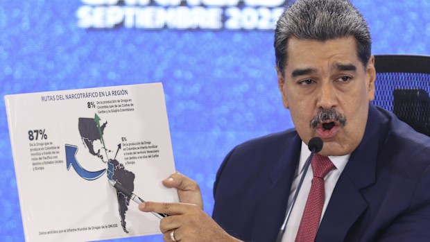Venezuelan President Nicolas Maduro points at a map of the Americas during a press conference in Caracas, Venezuela, Monday, Sept 15, 2025. (AP Photo/Jesus Vargas)