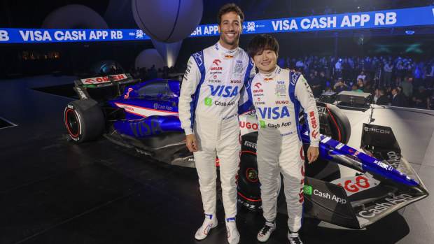 Daniel Ricciardo of Australia and Visa Cash App RB and Yuki Tsunoda of Japan and Visa Cash App RB pose for a photo with the Visa Cash App RB VCARB 01 at the Visa Cash App RB Livery Launch Event Las Vegas on February 08, 2024 in Las Vegas, Nevada. (Photo by Jesse Grant/Getty Images for Visa Cash App RB) // Getty Images / Red Bull Content Pool // SI202402090079 // Usage for editorial use only //