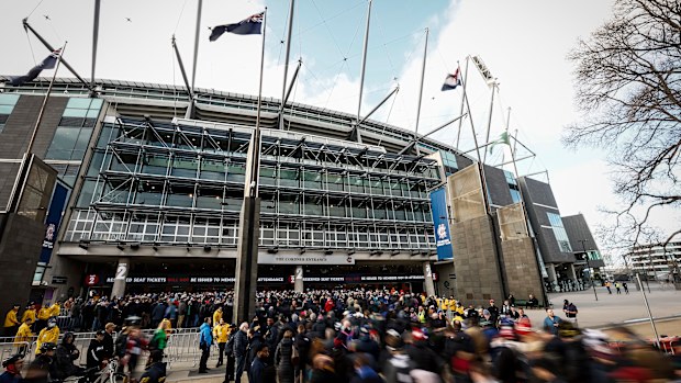 Fans line up at the MCC members entrance before the 2022 AFL Grand Final match between the Geelong Cats and the Sydney Swans at the Melbourne Cricket Ground on September 24, 2022 in Melbourne, Australia. (Photo by Darrian Traynor/AFL Photos/via Getty Images)