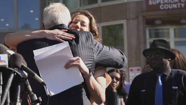 Anamaria Baralt, cousin of Erik and Lyle Menendez, hugs attorney Mark Geragos after a hearing in the brothers' case Friday, April 11, 2025, in Los Angeles. (AP Photo/Damian Dovarganes)