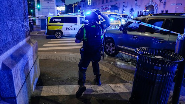 Police gather at the site of a mass shooting in Oslo, early Saturday, June 25, 2022. Norwegian police say a few people have been killed and more than a dozen injured in a mass shooting. (Javad Parsa/NTB via AP)