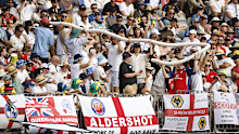 Fans keep themselves amused at Perth Stadium.